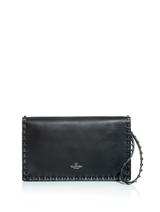 Valentino Valentino’s sleek luxury transpires to this studded leather clutch. A simple leather structure gets a rock’n’roll makeover with gunmetal pyramid studs. Carry yours with an all-black ensemble for a flawless evening look.