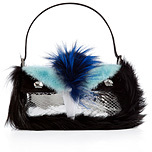 Styled with a cheeky face and crystal eyes, Fendi's owl Baguet...