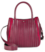 Remixed in tone-on-tone raspberry leather paneling, this Anya...