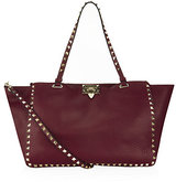 Commanding attention, Valentino’s Medium Rockstud Grain Shop...