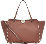 Valentino’s Medium Rockstud Grain Shopper commands style att...