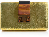 Lanvin Lanvin lead the way for opulent handbag design with this Minaudiere clutch. The gold hammered metal is given a directional edge with a stone and clasp making for an eye-catching after-hours essential.